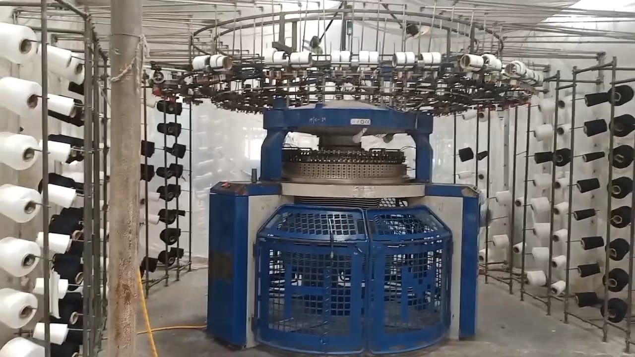 Industrial knitting machine creating custom fabric for apparel manufacturing at Alvieva Apparel factory in Bangladesh